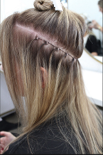 Actual Beads of Hair extensions on dark blonde hair