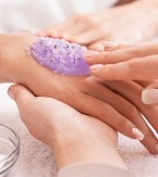 Lavender sugar scrub on a woman's hand