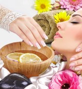 Image of woman enjoying a facial and a spa manicure image